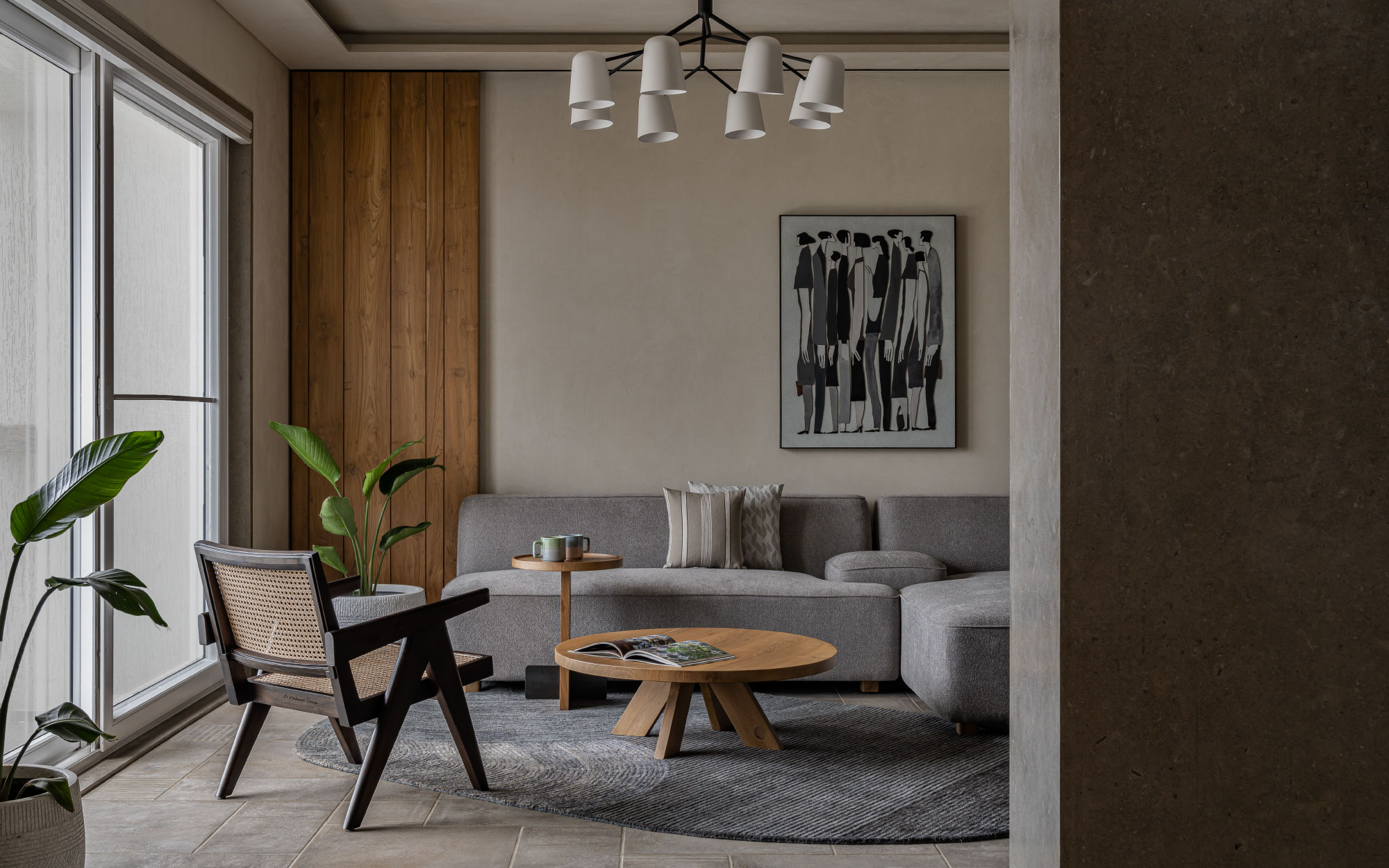 This home features a Japandi vibe with lights from Smart Lights India overlooking a rug from Jaipur Rugs’ novelty. The artwork is from Shree Rama The Gallery. (Image Credits: Nilkanth Bharuchaa)