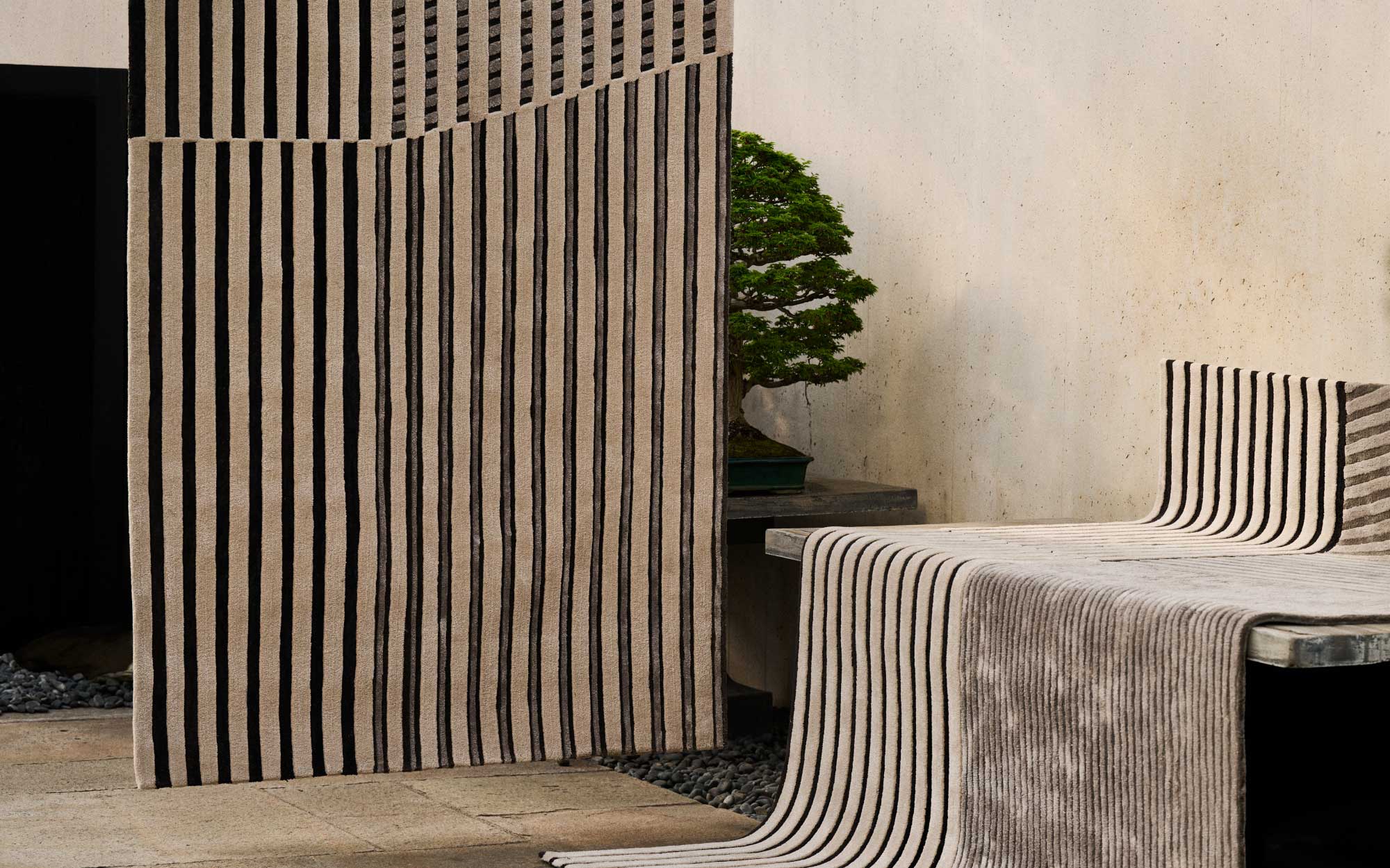 FACES is a nuanced collection of rugs capturing light, materiality, and spatial rhythm through handcrafted surfaces.  (Image Credits: Jaipur Rugs)
