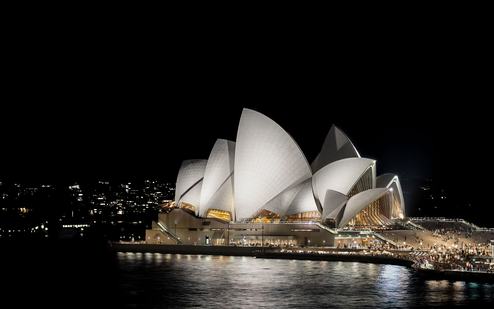 The Sydney Opera House rises as a constellation of sail-like shells clad in shimmering tiles, transforming the architect’s visionary sketches into one of the most recognisable monuments of modern architecture. (Image Credits: Hamilton Lund)