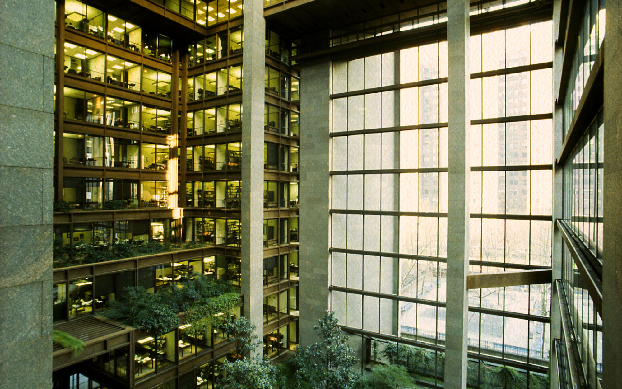 The Ford Foundation building features a garden in the atrium with offices overlooking it. (Image Credits: KRJDA)