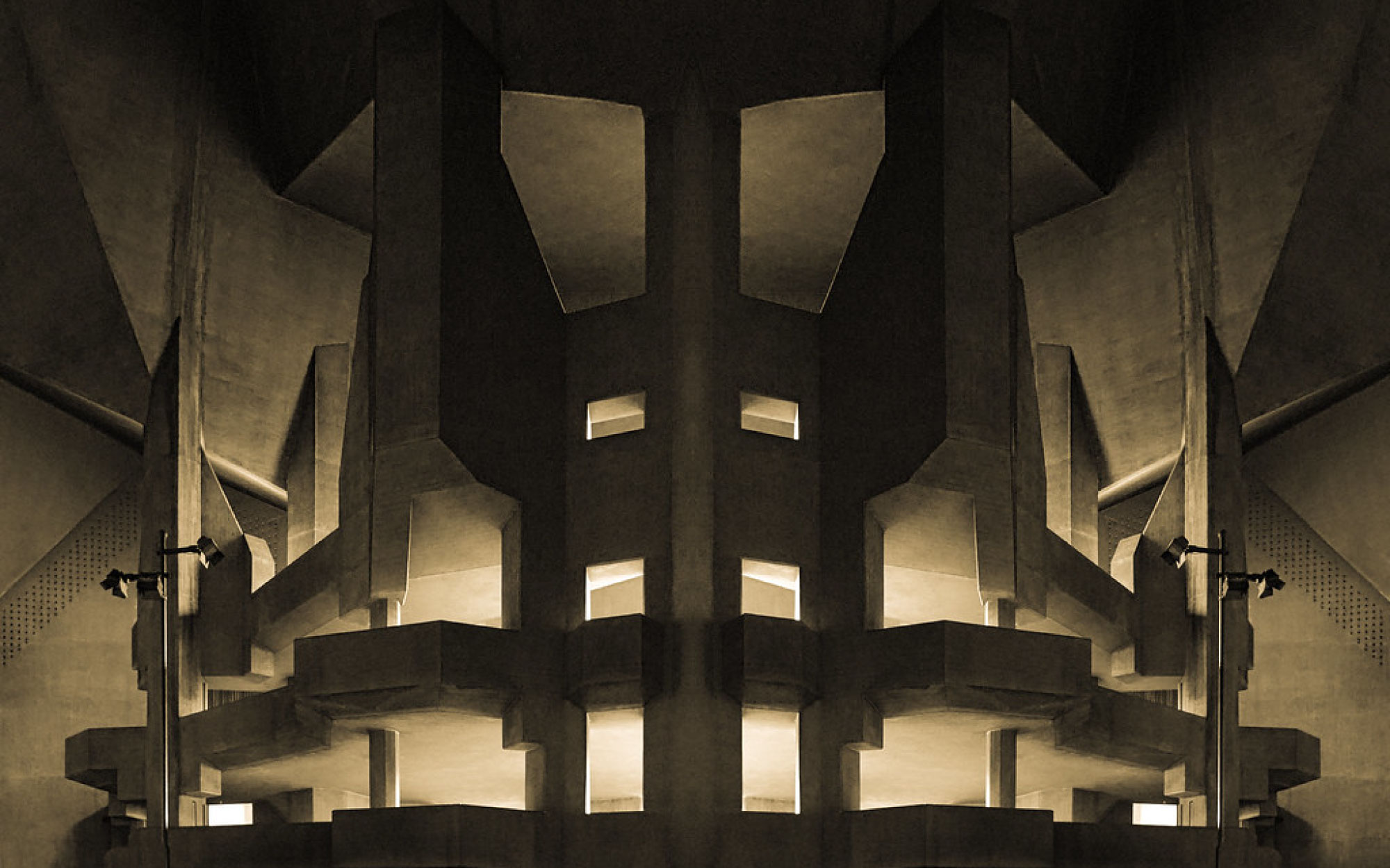 The Neviges Mariendom unfolds as a monumental concrete sculpture, its angular peaks and cavernous interior creating a dramatic sanctuary shaped by light and shadow. (Image Credits: M. Greskowiak from Flickr)