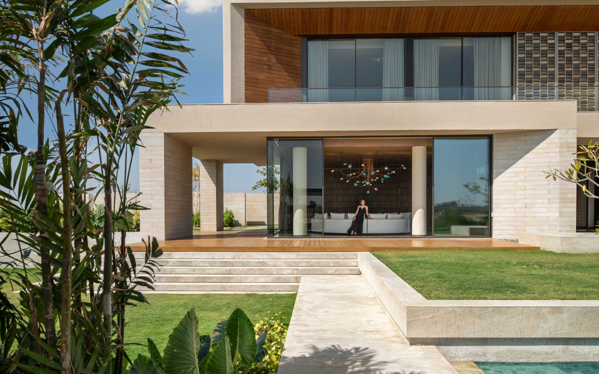 With colossal French windows and expansive alfresco decks designed for lingering, each villa turns outward toward the water. (Image Credits: Suryam Developers)
