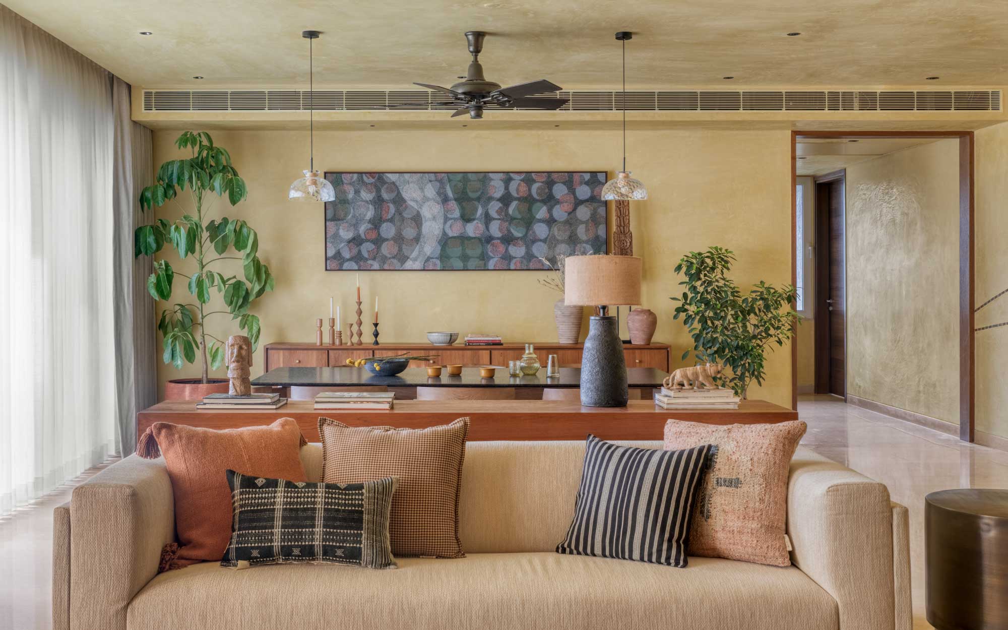 The textile artwork, ‘Kshitichitra’, is paired with yellow ochre walls and an overall earthy palette. (Image Credits: Pulkit Sehgal)
