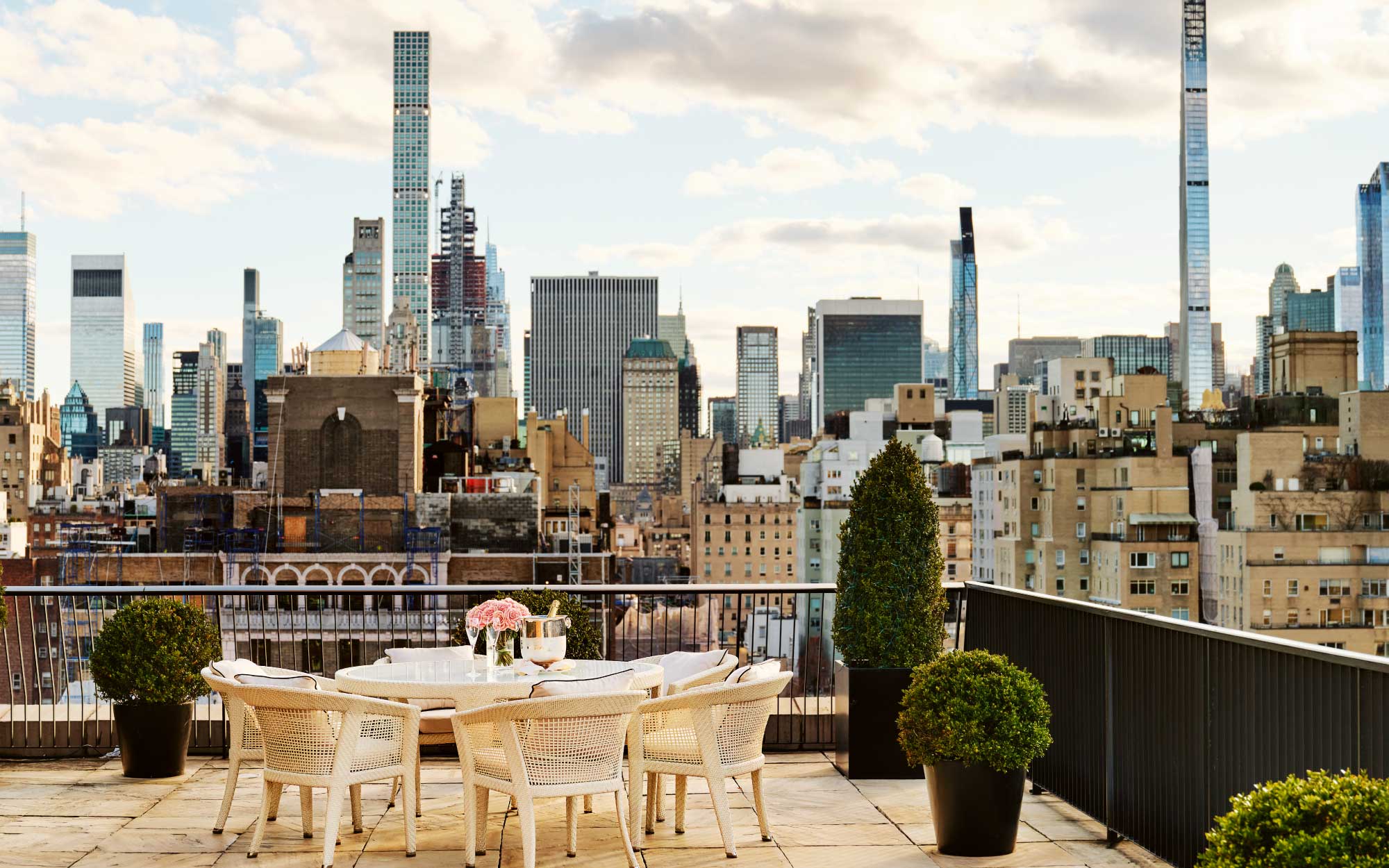 From its alfresco perches, New York City’s skyline unfurls as a shifting tableau with glass and stone catching the light in a rhythm that feels at once cinematic and endlessly in motion. (Image Credits: Adrian Gaut)
