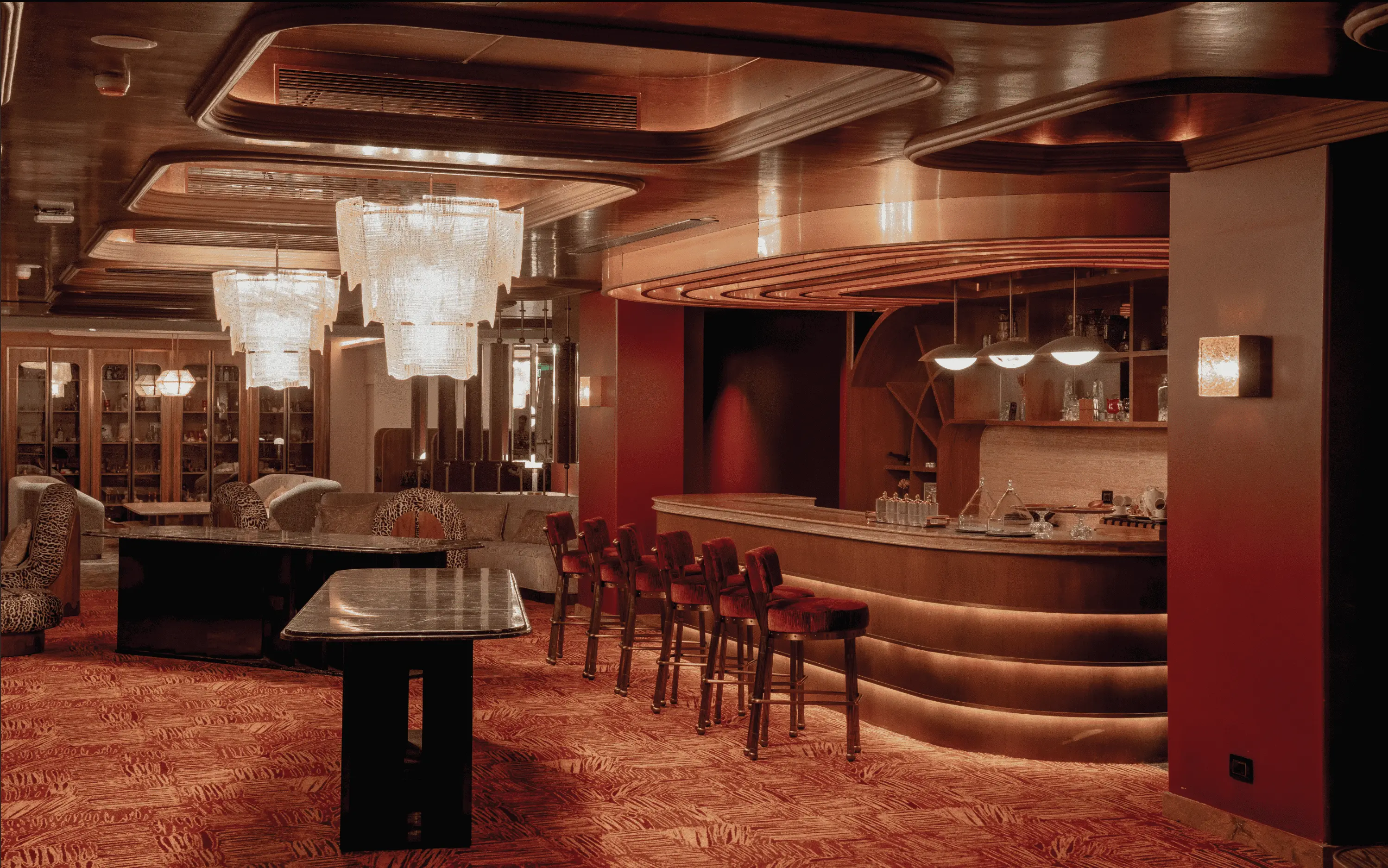 The Third Room is conceived as a curated members’ only club for business leaders. Designed more like a richly layered fashion house office, the interiors are enveloped in deep maroon tones, punctuated by intimate bar counters and discreet conversational nooks. ( Image Credit: Roswyn - A Morgans Original Hotel) 