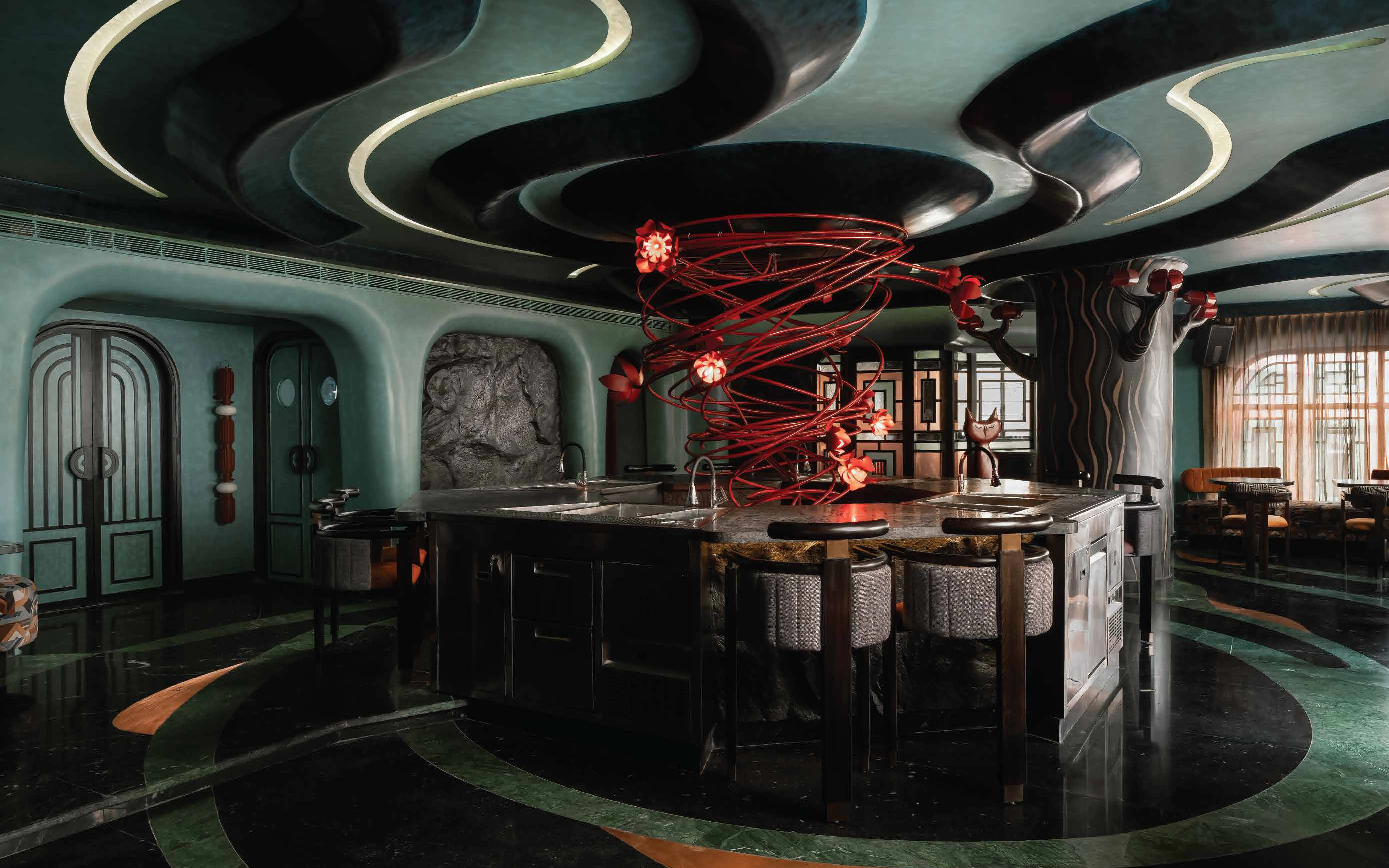 Designed by Studio Camarada, wavy lines ripple above the octagonal bar at Naked & Famous and flow along faux tree trunks that transform into cat figures in adjoining rooms, reinforcing a playful feline motif throughout the interiors. (Image Credits: Studio Camarada)
