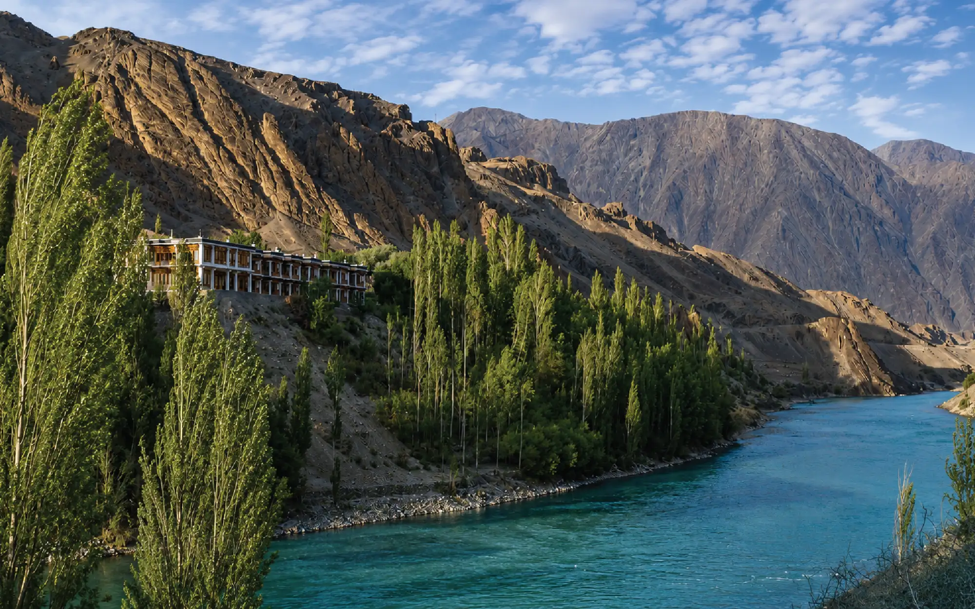Set amid poplar groves, with the Indus mirroring the sky and the rugged Himalayas beyond, Apricot Tree offers an authentic Ladakhi mountain retreat. (Image credit: The Apricot Tree)