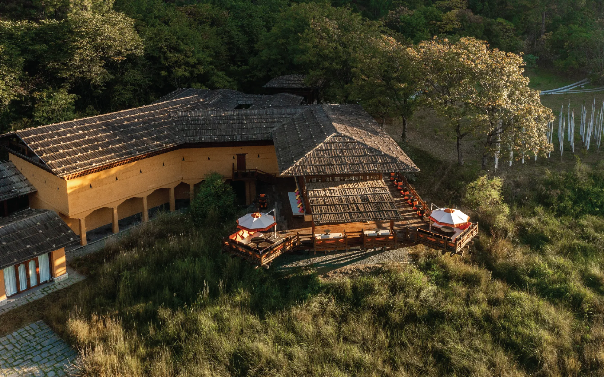The composition of the Facade echoes the defining characteristics of a traditional dzong: imposing exterior walls, layered enclosures and a sense of discovery that reveals itself incrementally rather than all at once. ( Image Credit: Pemako Bhutan)