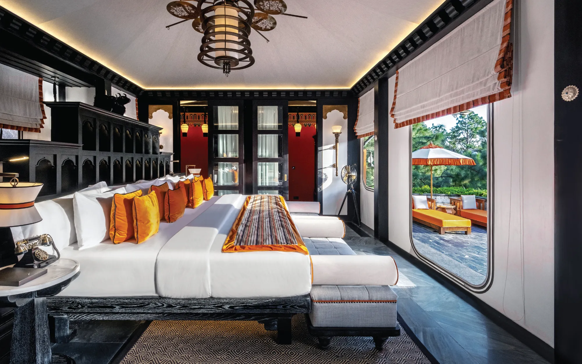 Dramatic ebony-black timber headboards create a sense of depth and warmth, while custom-designed canvas panels framed with borders inspired by Bhutan's national colours introduce subtle cultural references into the living spaces. (Image Credit: Pemako Bhutan)