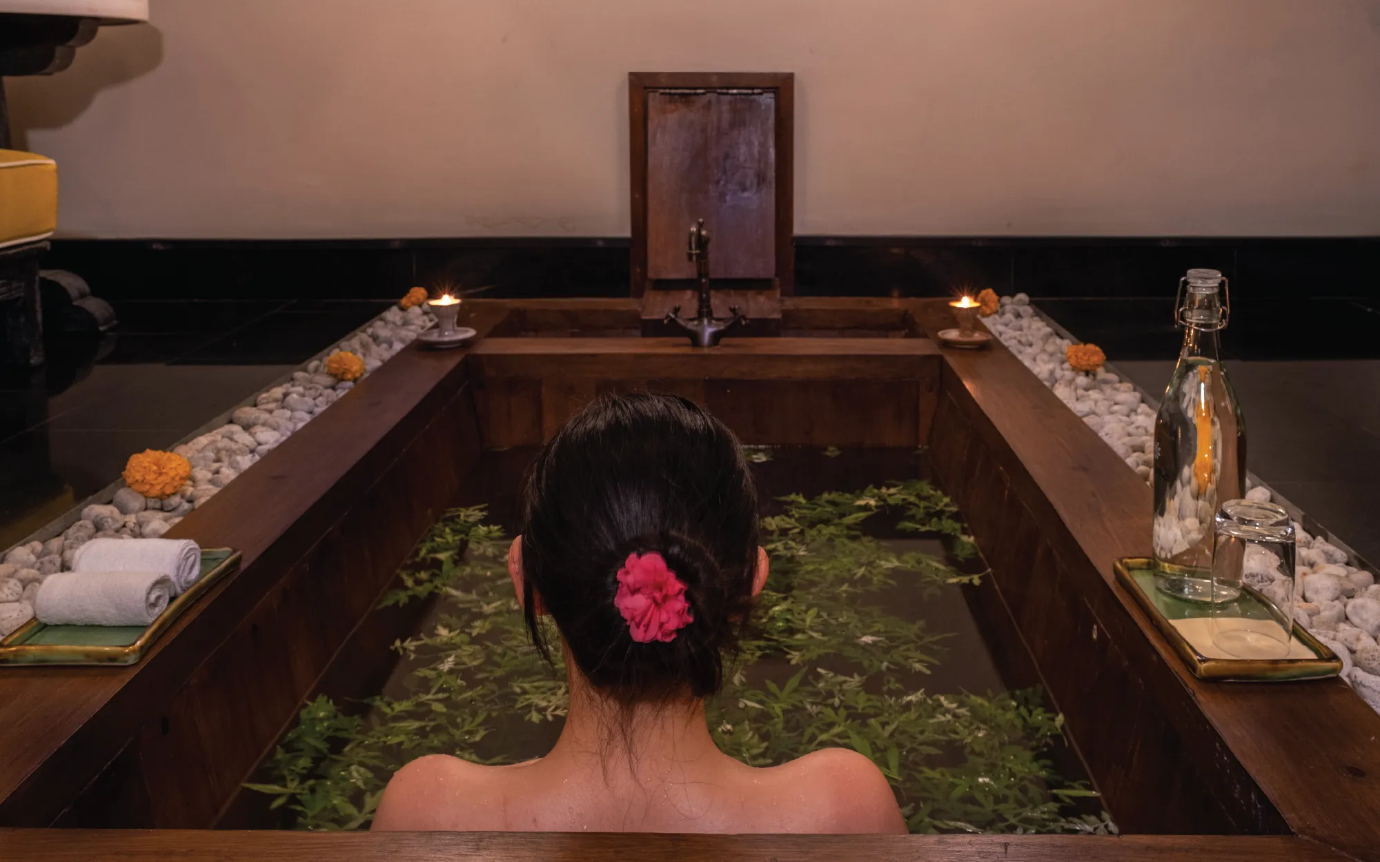 The hot stone bath at Pemako is a ritual steeped in Himalayan tradition. Fresh, clean water fills the wooden tub before being heated by river stones, carefully selected for their natural mineral richness. (Image Credit: Pemako Bhutan)