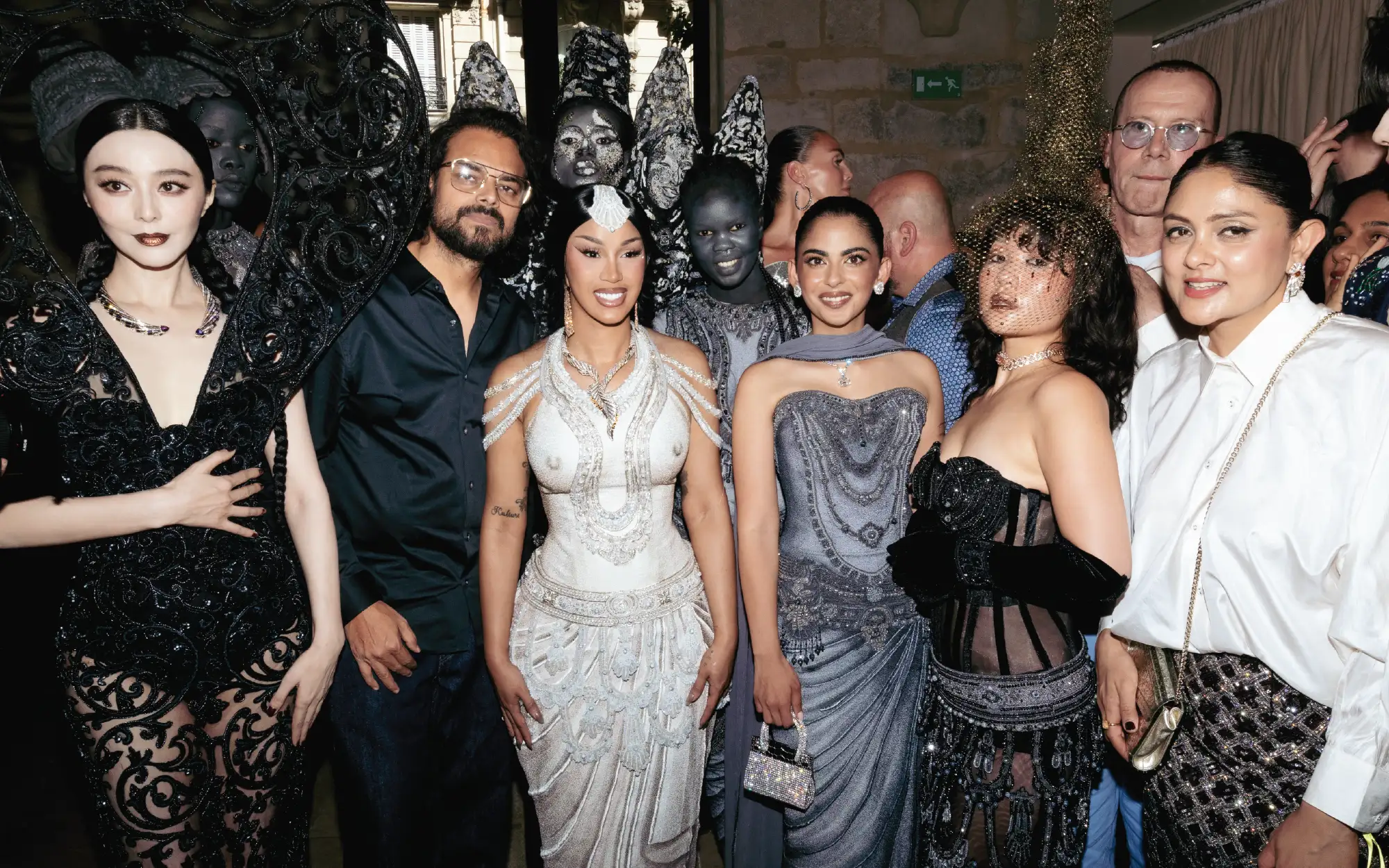 Designers and co-founders Rahul and Divya Mishra pose with actress Fan Bingbing, rapper and singer Cardi B, entrepreneur Isha Ambani, South Korean rapper Rei Ami, and the models from the runway show. (Image Credits: Rahul Mishra, Valerio Mezzanotti / Nowfashion)