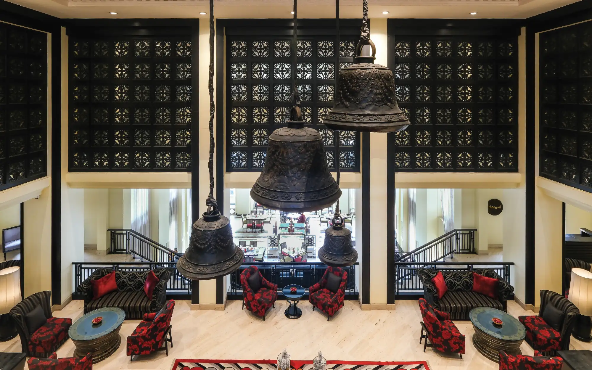 Suspended from the ceiling, the bell installation is as much a work of art as it is a tribute to Bhutan's Buddhist traditions. (Image Credit: Pemako Bhutan) 