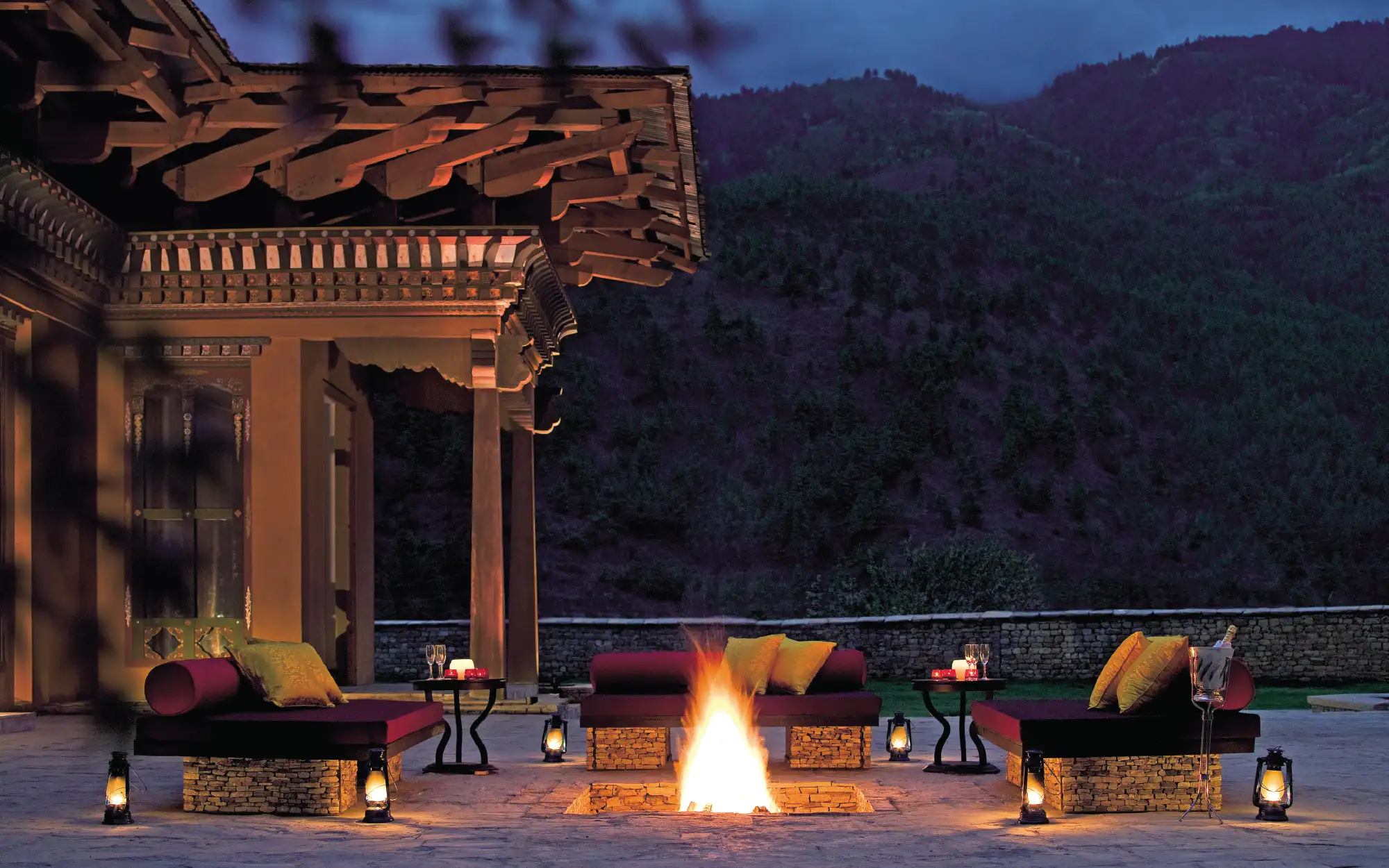 End the evening around a crackling bonfire, where a thoughtfully curated dinner is accompanied by traditional music and dance. (Image Credit: Pemako Bhutan) 